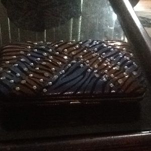 Like New clutch with zebra print and bling.