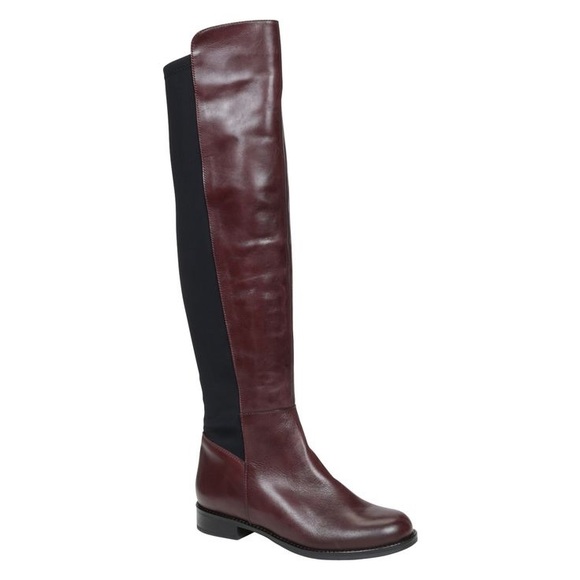 Barely worn purple leather flat boots.