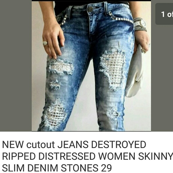 SOLD.     Destressed jeans size 29