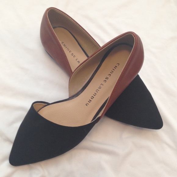 Black and brown pointed flats