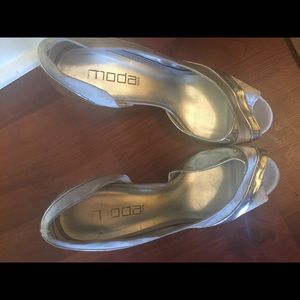 Silver heels that were worn once. Minor marks.