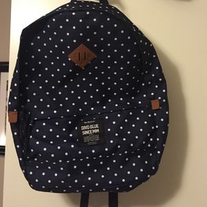 Navy and white polka dot book bag