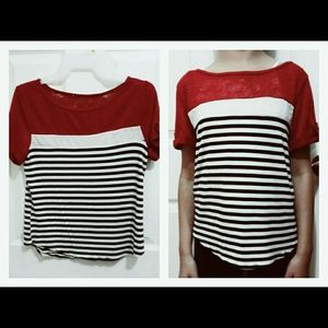 Red/black/white striped top.