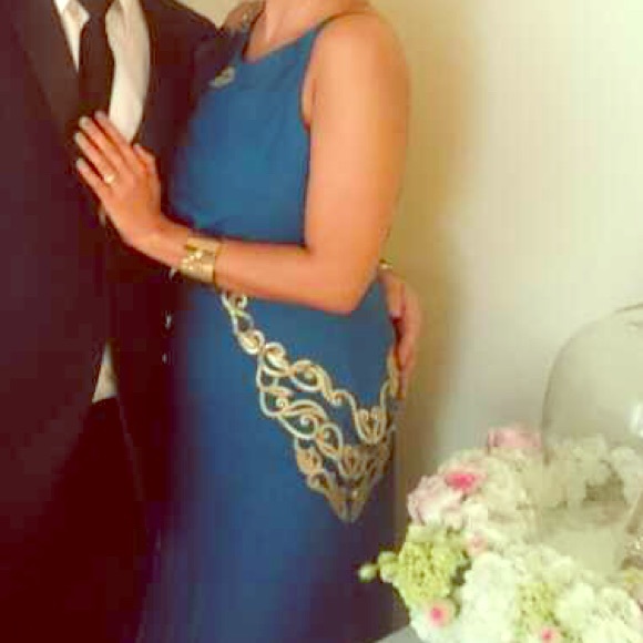 Peacock green gown with side gold details