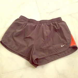Nike grey and orange running shorts with lining
