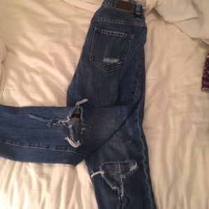 medium wash ripped high waisted cropped jeans