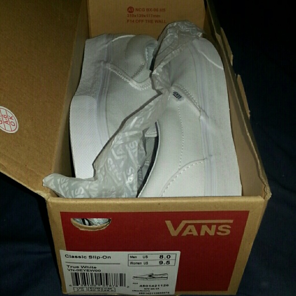 White slip on Vans