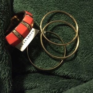 4 piece orange bracelet set.