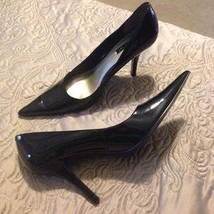 Nine West patent leather pointy-toe heels.