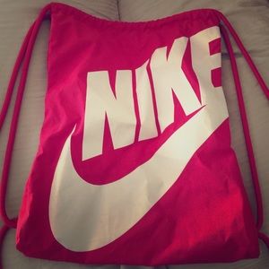 Hot pink Nike drawstring bag