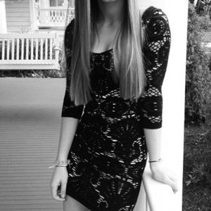 Beige and Black lace-looking patterned dress.