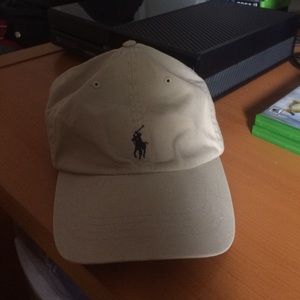 Cream Polo Hat with brown leather strap.