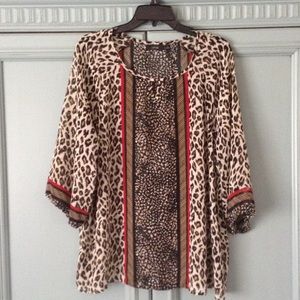 Leopard print/red loosefitting XL. Fits like Xxl