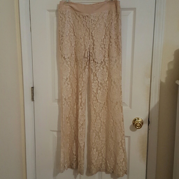 Cream lace pants with sewn in shorts.