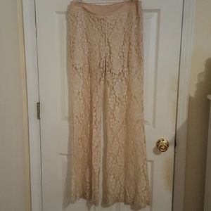 Cream lace pants with sewn in shorts.