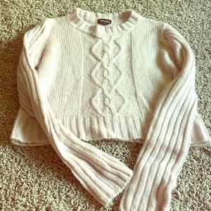 Light purple cable knit sweater.