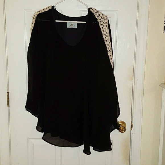 Black poncho with matching skirt