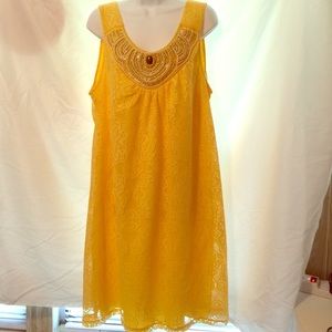 Bright yellow lace over more yellow jeweled dress