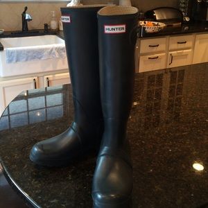 Hunter tall boots.
