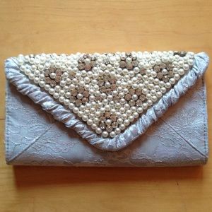 Light blue clutch with lace overlay