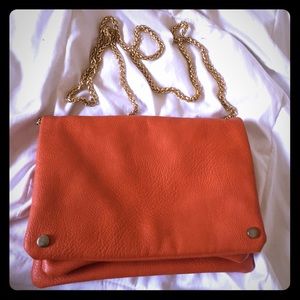 Small orange over the shoulder purse