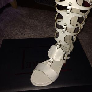 Off White leather gladiator sandals.