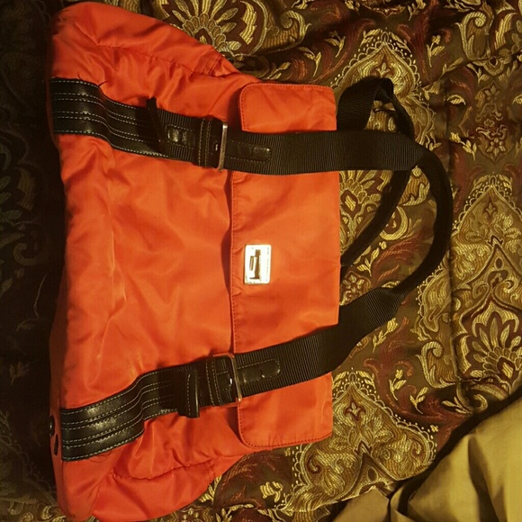 Orange Kenneth Cole reaction bag
