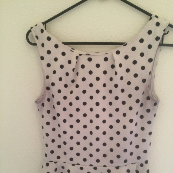 Peplum poka dot top