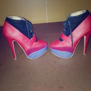 High heeled tie up boots