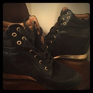 Chic black and gold wedge sneakers