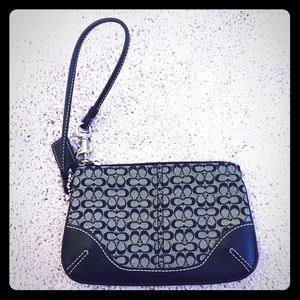 Black and gray Coach wristlet with silver hardware