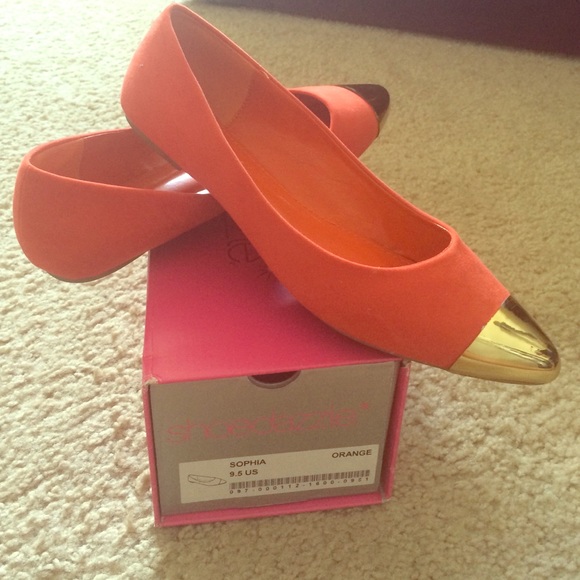 Orange flat with gold cap toe