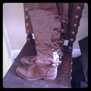 Tall up to the knee brown boots with bow ties 10