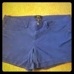 Shorts, above the need but under the buttocks.