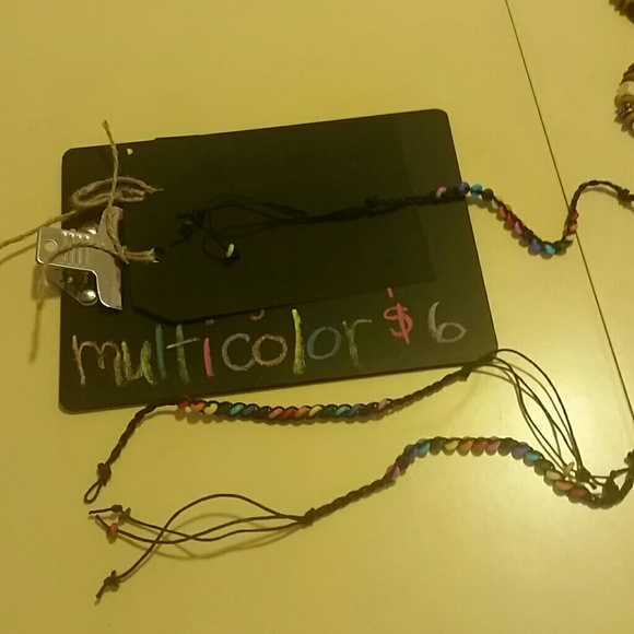 Multicolored bracelets w/colorful beads braided in