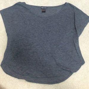 Small grey short sleeve t-shirt.