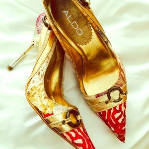 Gold pointed toe heels by Aldo.