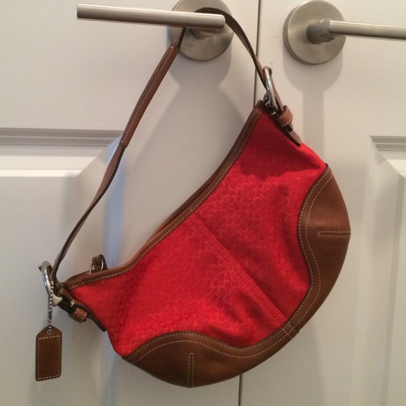 Red logo embossed Coach handbag