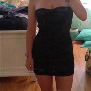 Black cocktail dress with hot pink open back