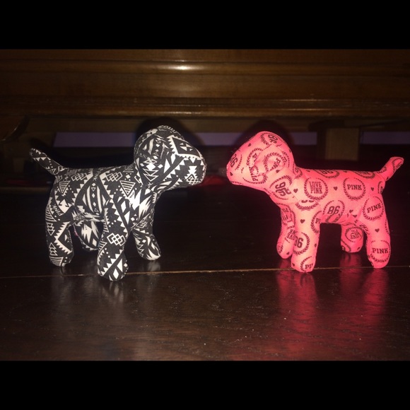 two miniature PINK dogs