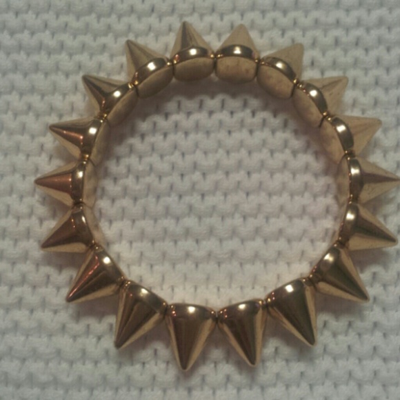 Gold spike accessory bracelet.