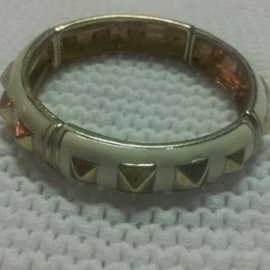 White and gold accessory bracelet.