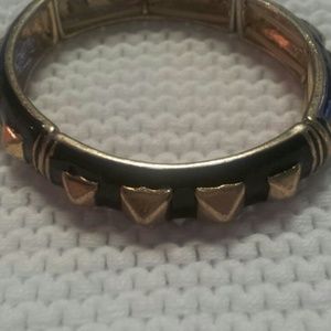 Black and gold accessory bracelet.