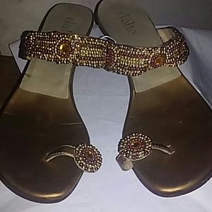 Gold beaded sandals.