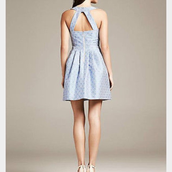 Fit and flare with open back dress. Worn twice.
