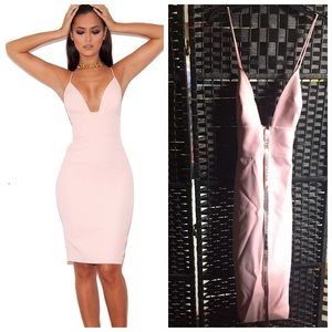 A blush pink low cut dress from House of London