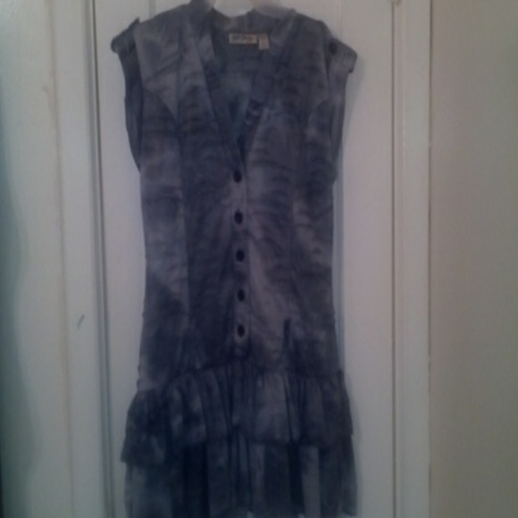 Grey button down top with ruffled bottom.