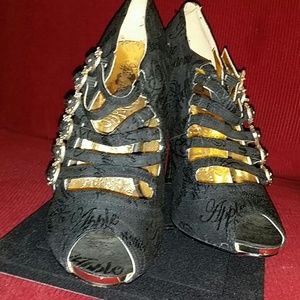 Black shoes with gold heels
