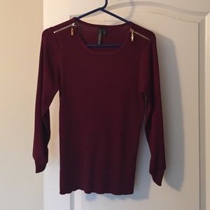 Burgundy sweater, gold zipper detailing