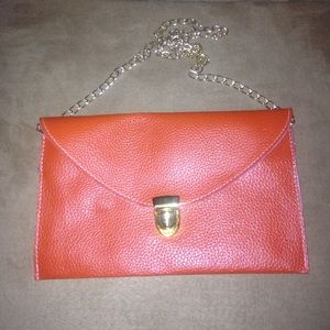 Burnt orange clutch